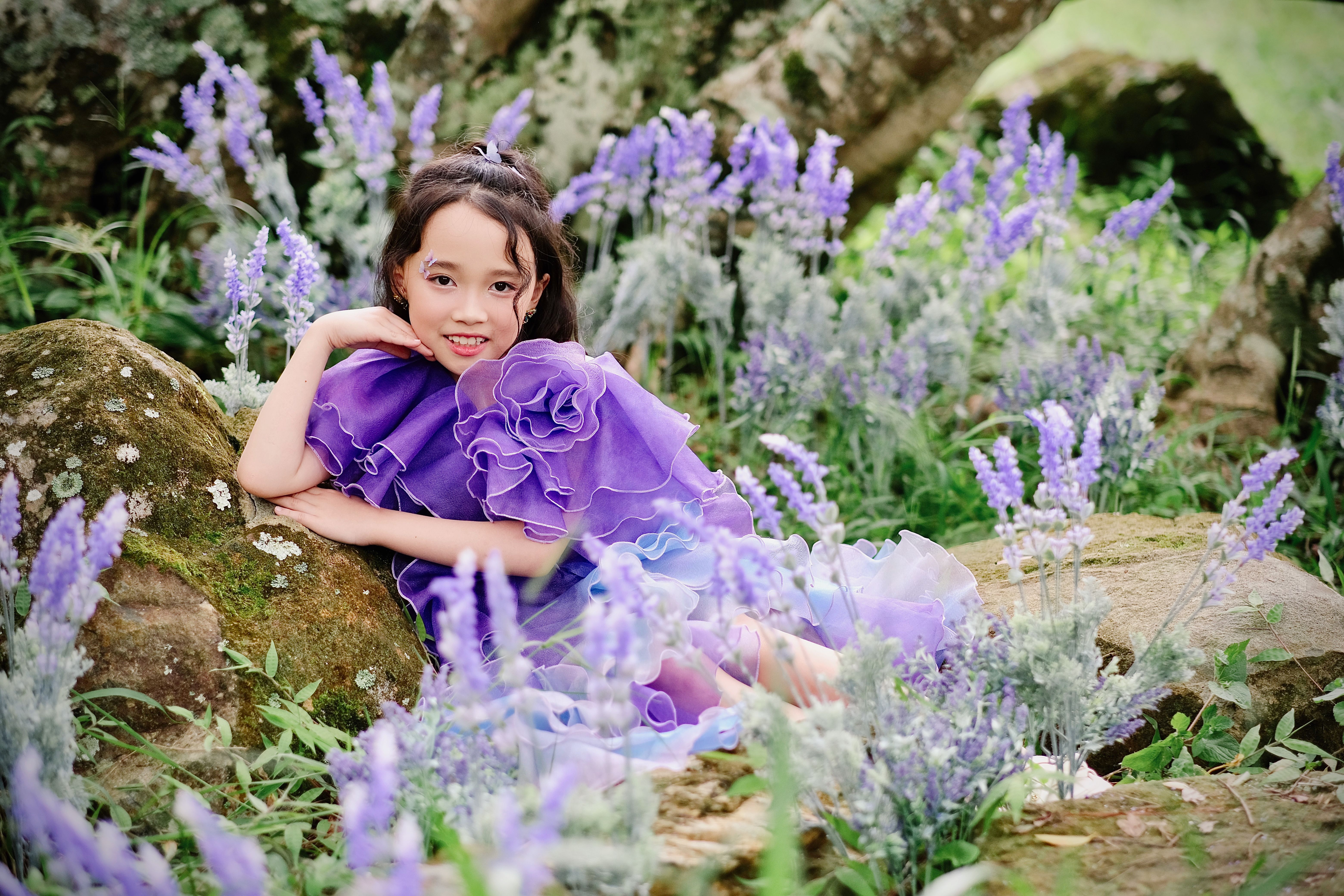 Girl in Purple Dress Sitting among Purple Flowers · Free Stock Photo