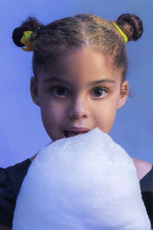 Girl Eating Cotton Candy