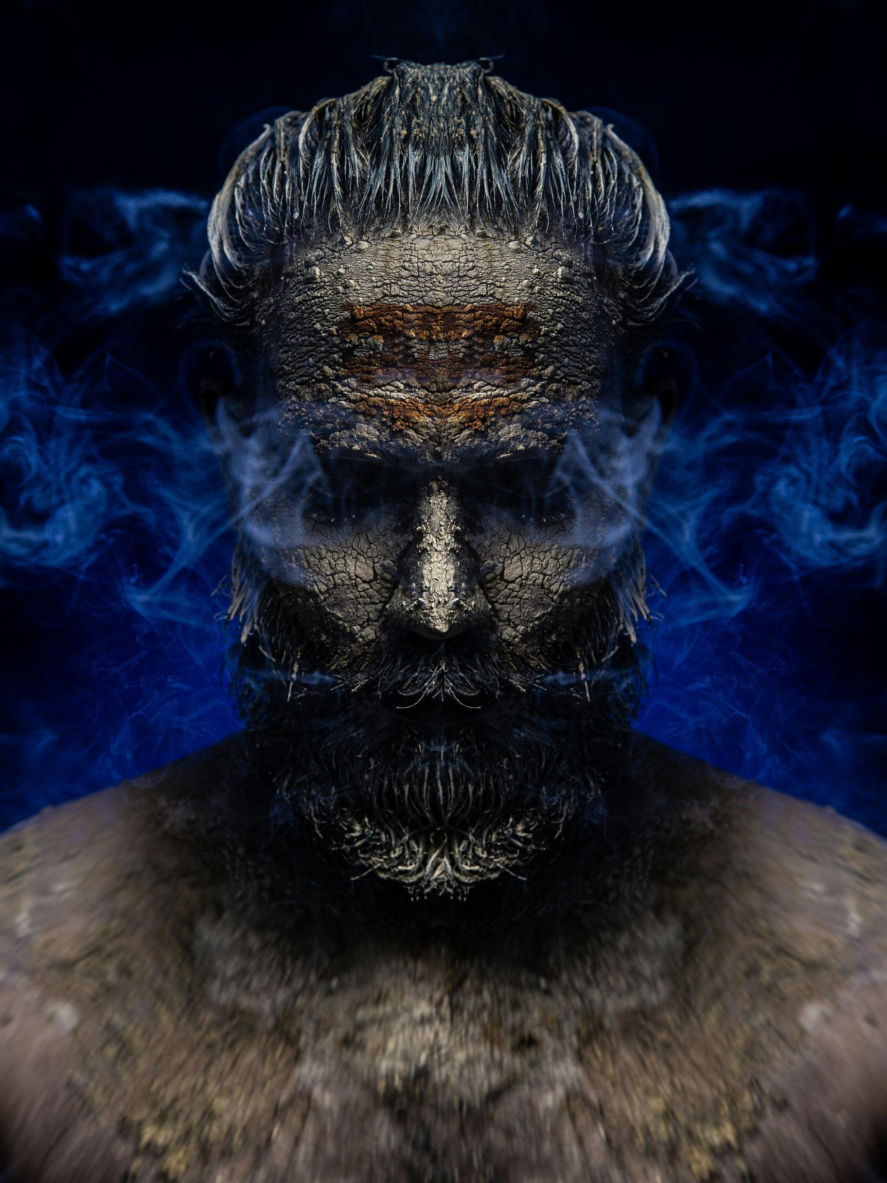 fantasy image of a mans portrait in blue smoke