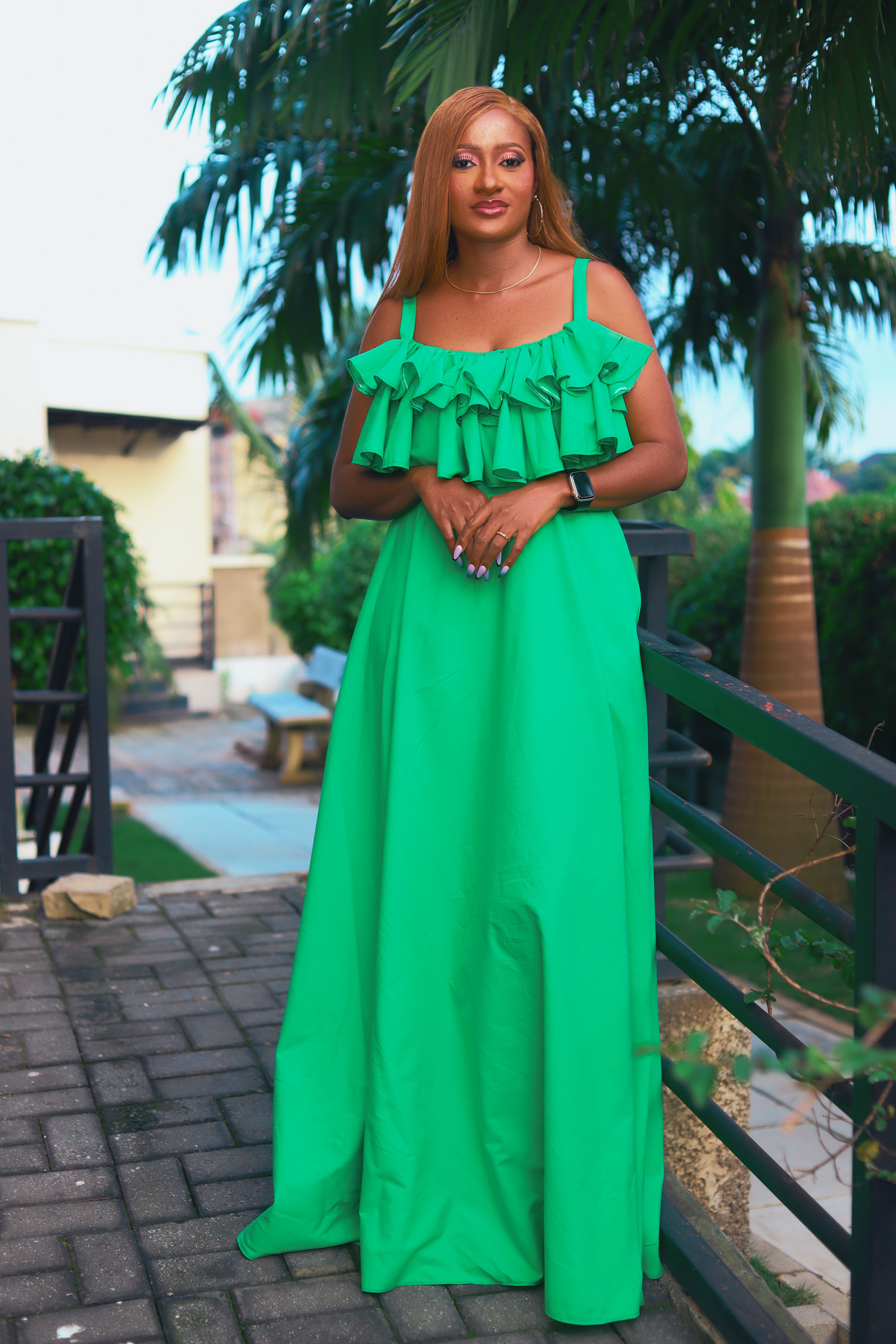 Woman with Red Hair, Wearing a Green Dress, Standing on a Footbridge ...
