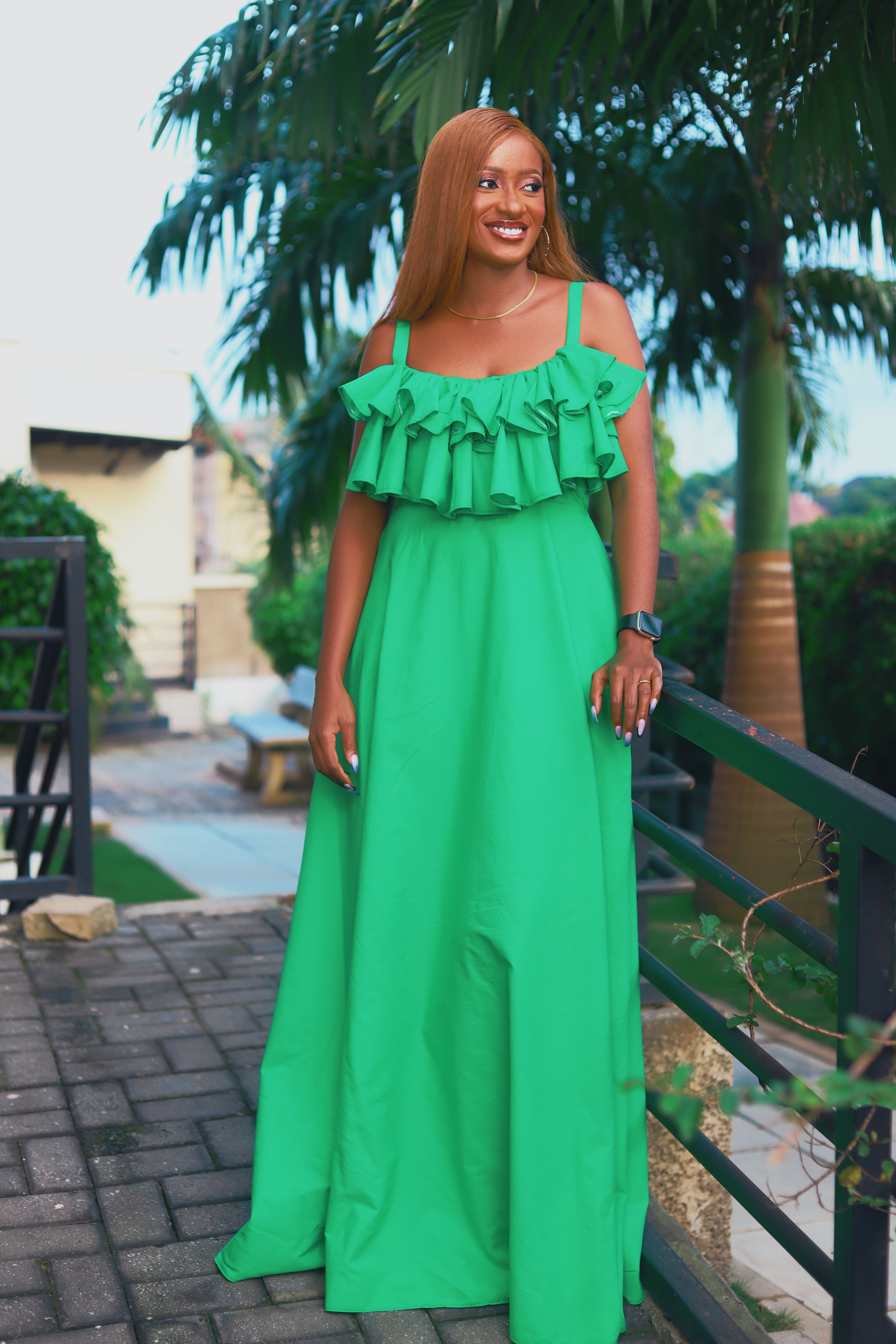 Woman with Red Hair and Wearing a Green Dress Standing on a Footbridge ...