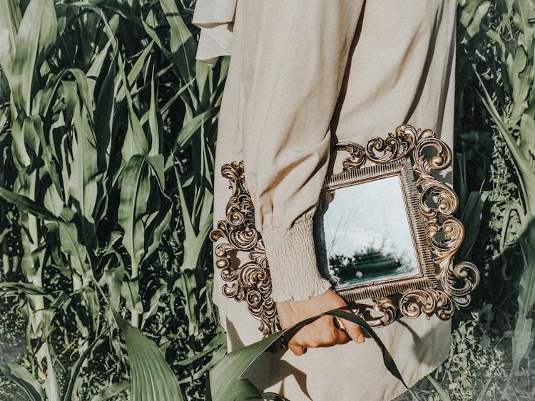 Woman Carrying Vintage Mirror