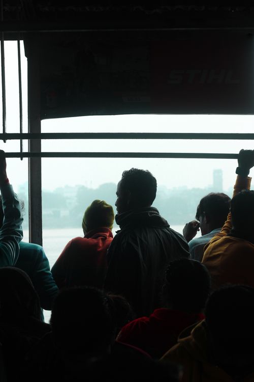 Free A crowded ferry in Kolkata, India, with people standing and looking out over the water. Stock Photo