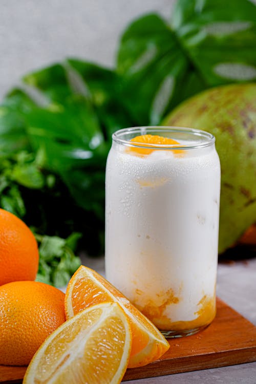 Free Oranges and Drink in Glass Stock Photo