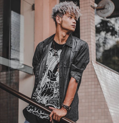 Man Leaning On Stair Rail