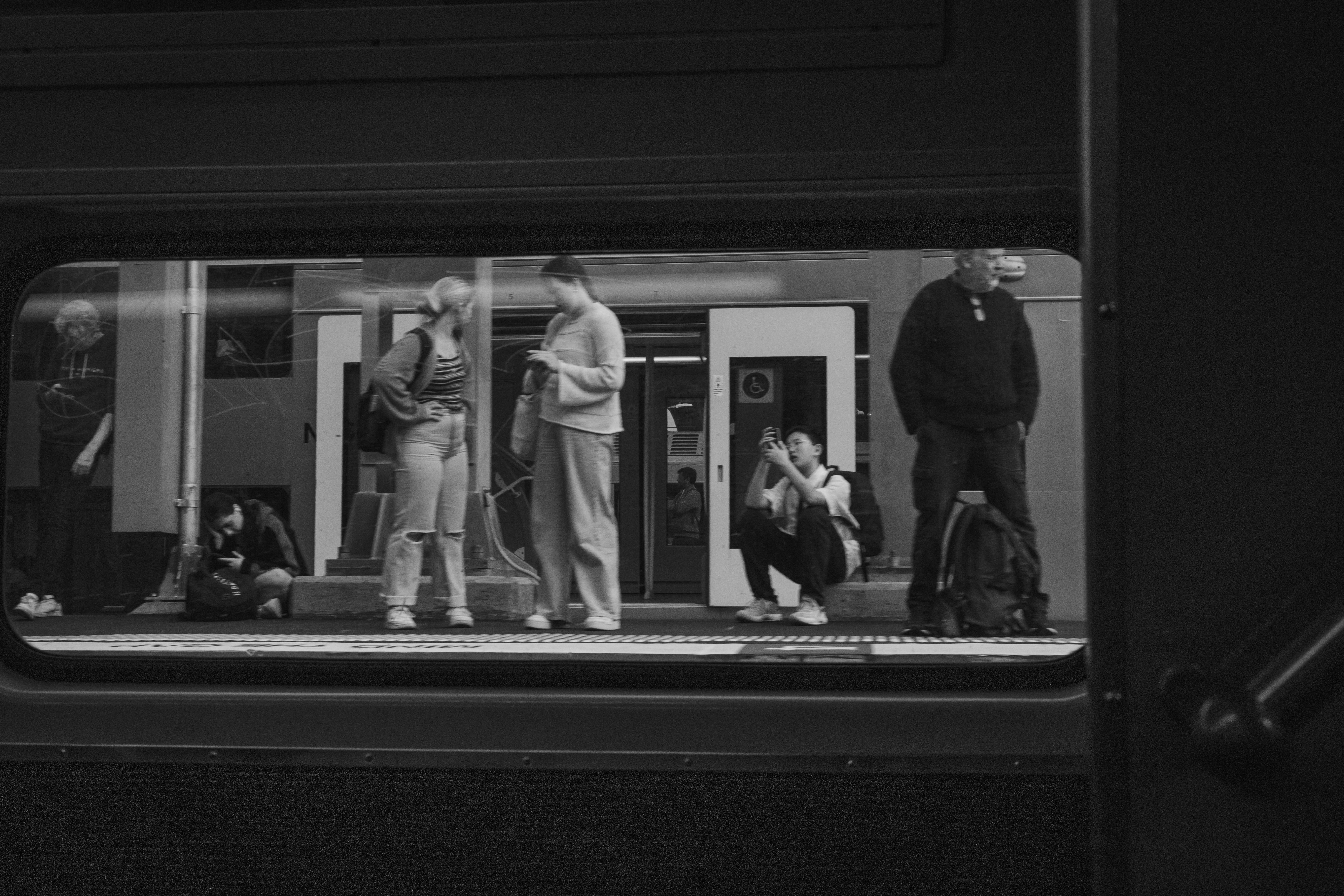 Sydney train station platform, clean and modern, few people