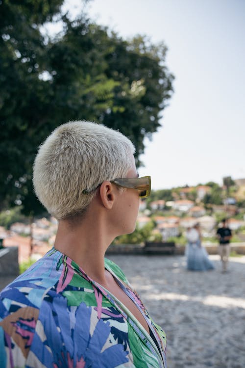 Woman in Sunglasses and with Short, Dyed Hair
