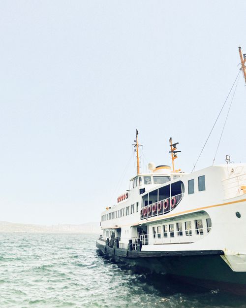 Free Serene view of a ferry cruising through calm waters under a clear sky, perfect travel moment. Stock Photo