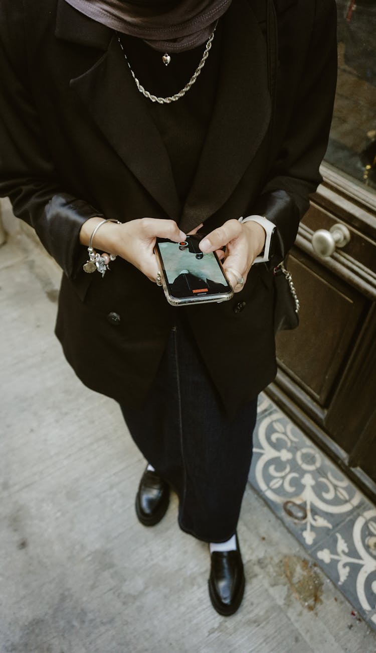 Elegant Woman Holding Smartphone