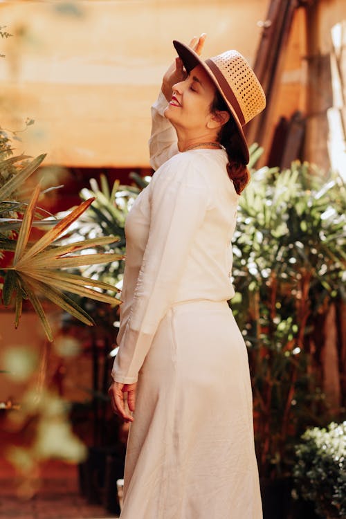 Woman in Sunhat with Close Eyes