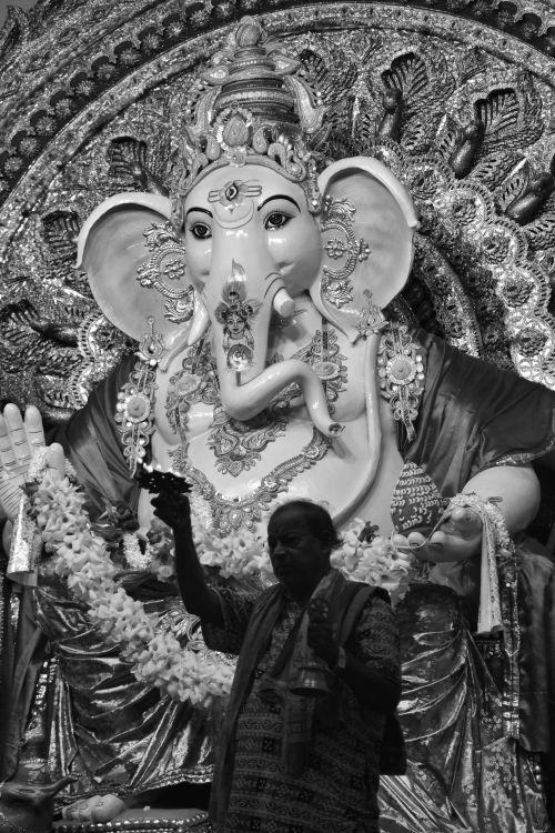 Free Majestic Ganesha statue adorned with decorations, captured in a cultural setting in India. Stock Photo