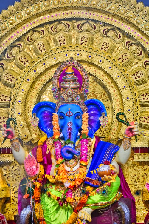 Free Colorful statue of Lord Ganesha with intricate detailing in a Jatni, India temple. Stock Photo