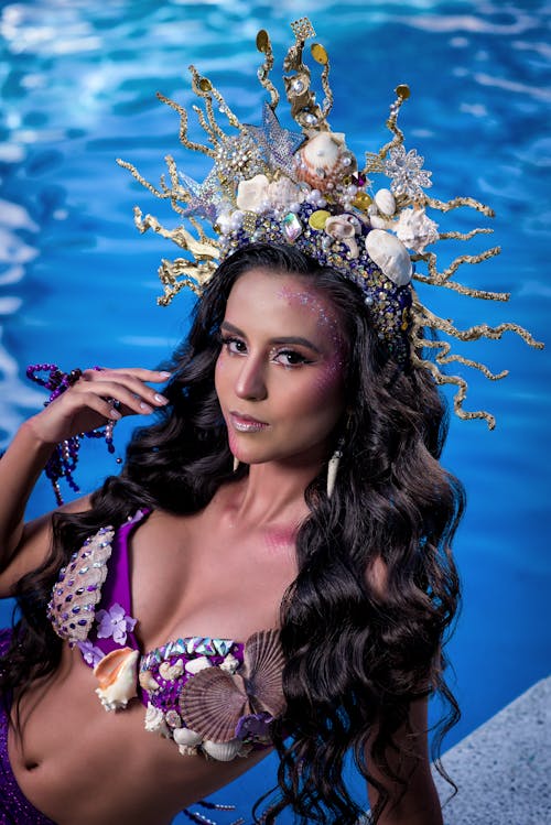 Woman in Bra and Crown Decorated with Shells