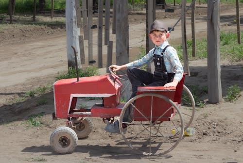 Boy Riding Retro Tractor