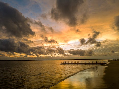A stunning sunset casts vibrant colors over the tranquil seashore in Colombo, Sri Lanka.