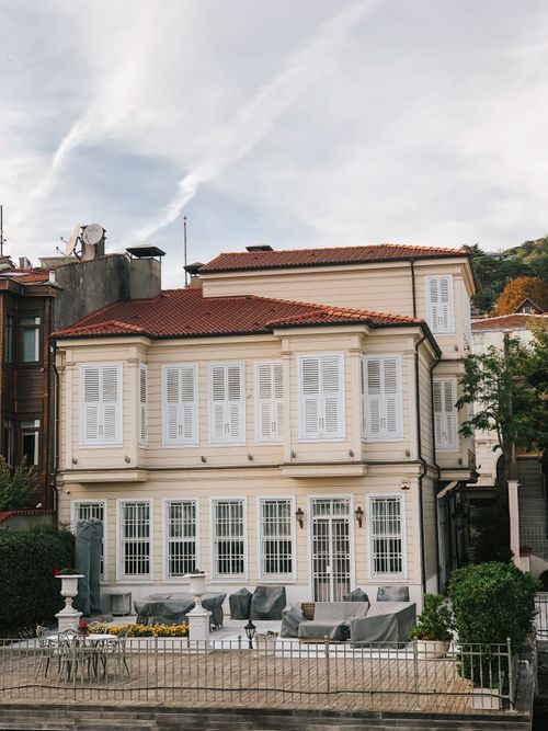 Free Elegant two-story Mediterranean style villa with shutters and red roof. Stock Photo
