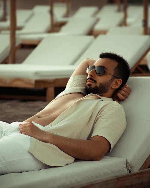 Man Lying on a Sunbed