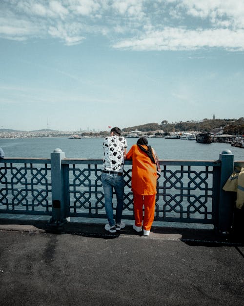 Woman and Man Standing on Galata Bridge in Istanbul