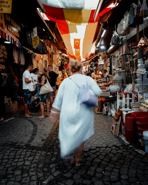 Woman Walking in Bazaar Alley in City in Turkey