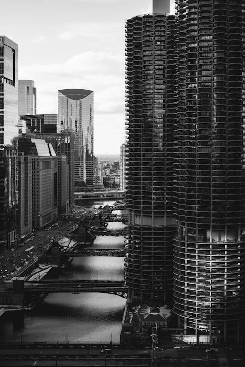 Grayscale Photo Of Buildings Near River