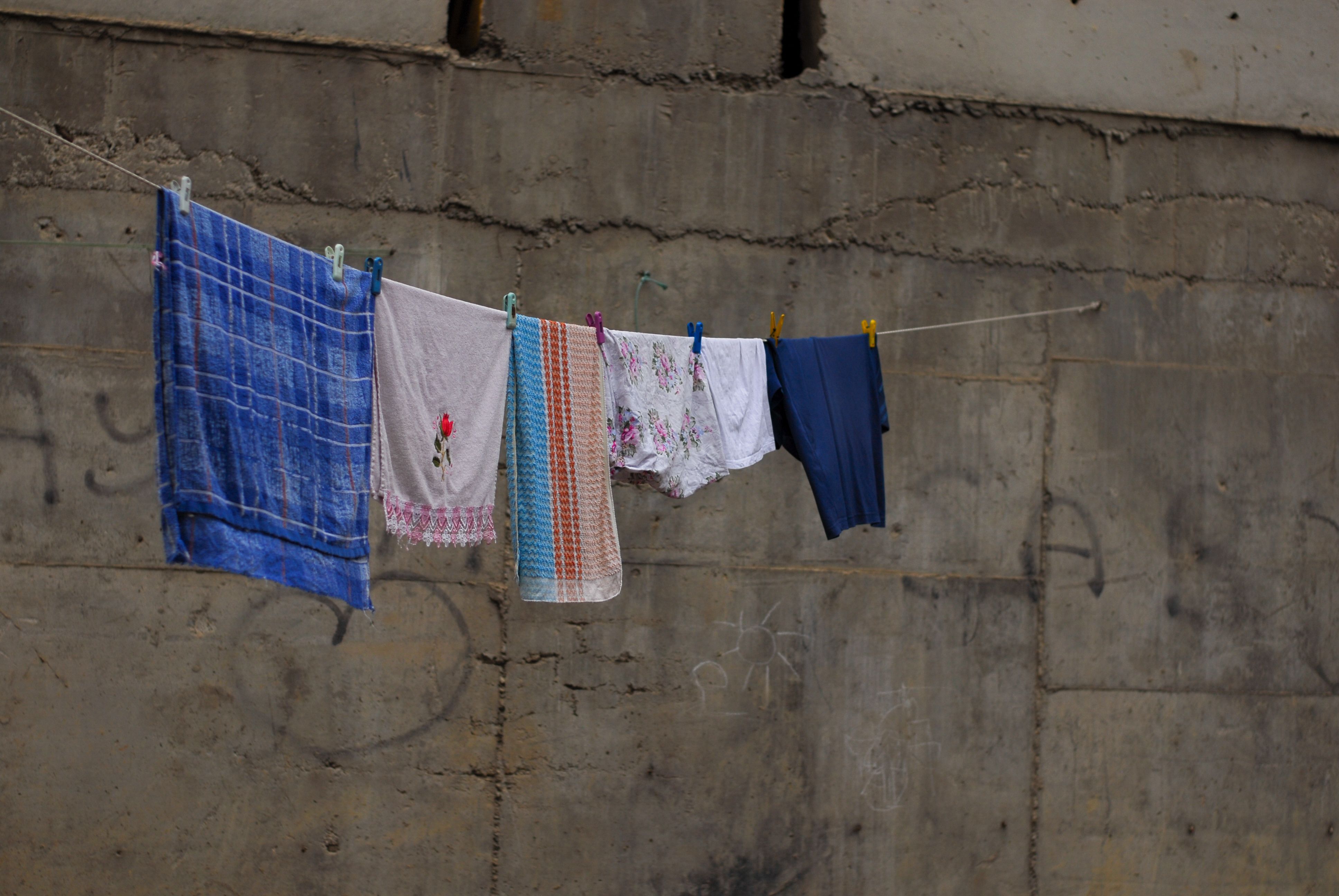 Towels and Clothes Drying on String · Free Stock Photo