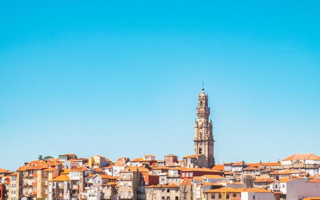 Photo: Mo Eid on Pexels Baroque Clérigos Tower standing tall in Porto, Portugal cityscape under a vivid blue sky.