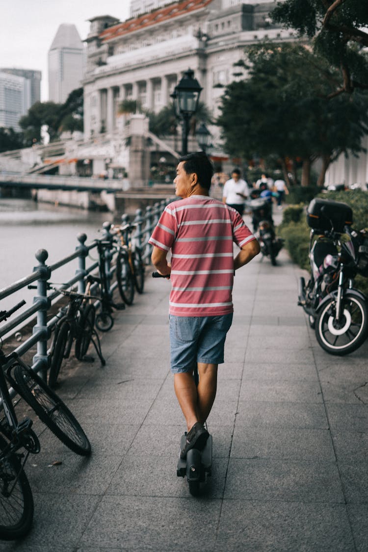 Man Riding Electric Scooter