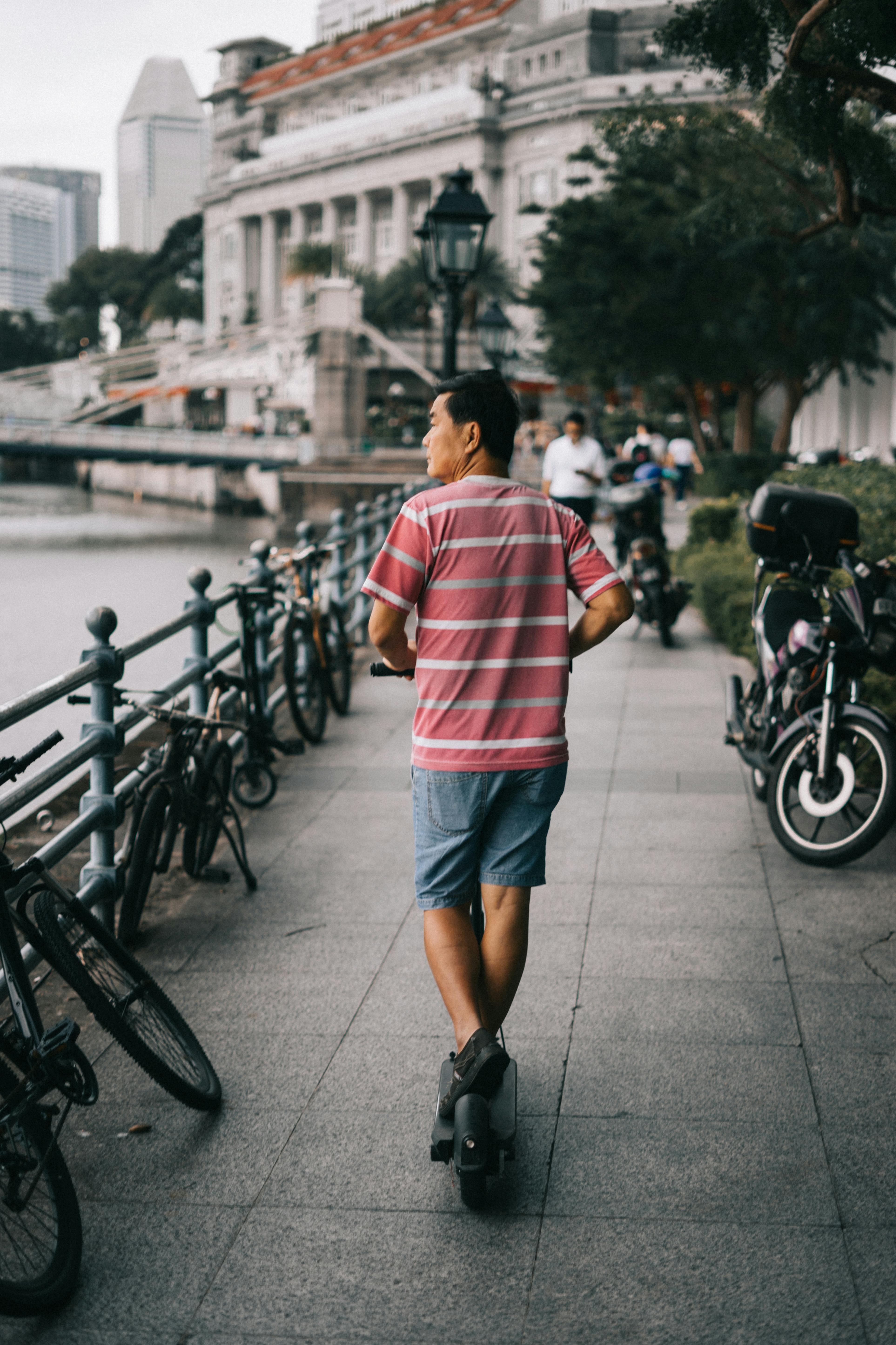 Man Riding Electric Scooter \u00b7 Free Stock Photo