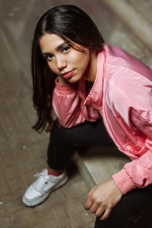 Young Brunette in Pink Jacket