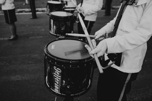 Soldier Playing on Drum on a Parade in Black and White