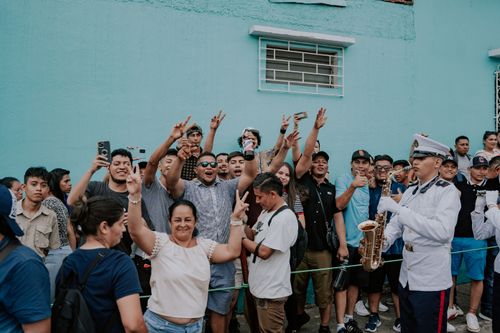 Free A festive street scene capturing a cheerful crowd at a parade, showcasing community spirit and celebration. Stock Photo