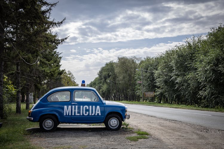 Police Car By Road 