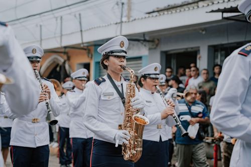 Free Military band playing saxophones and clarinets during a street parade in El Salvador. Stock Photo