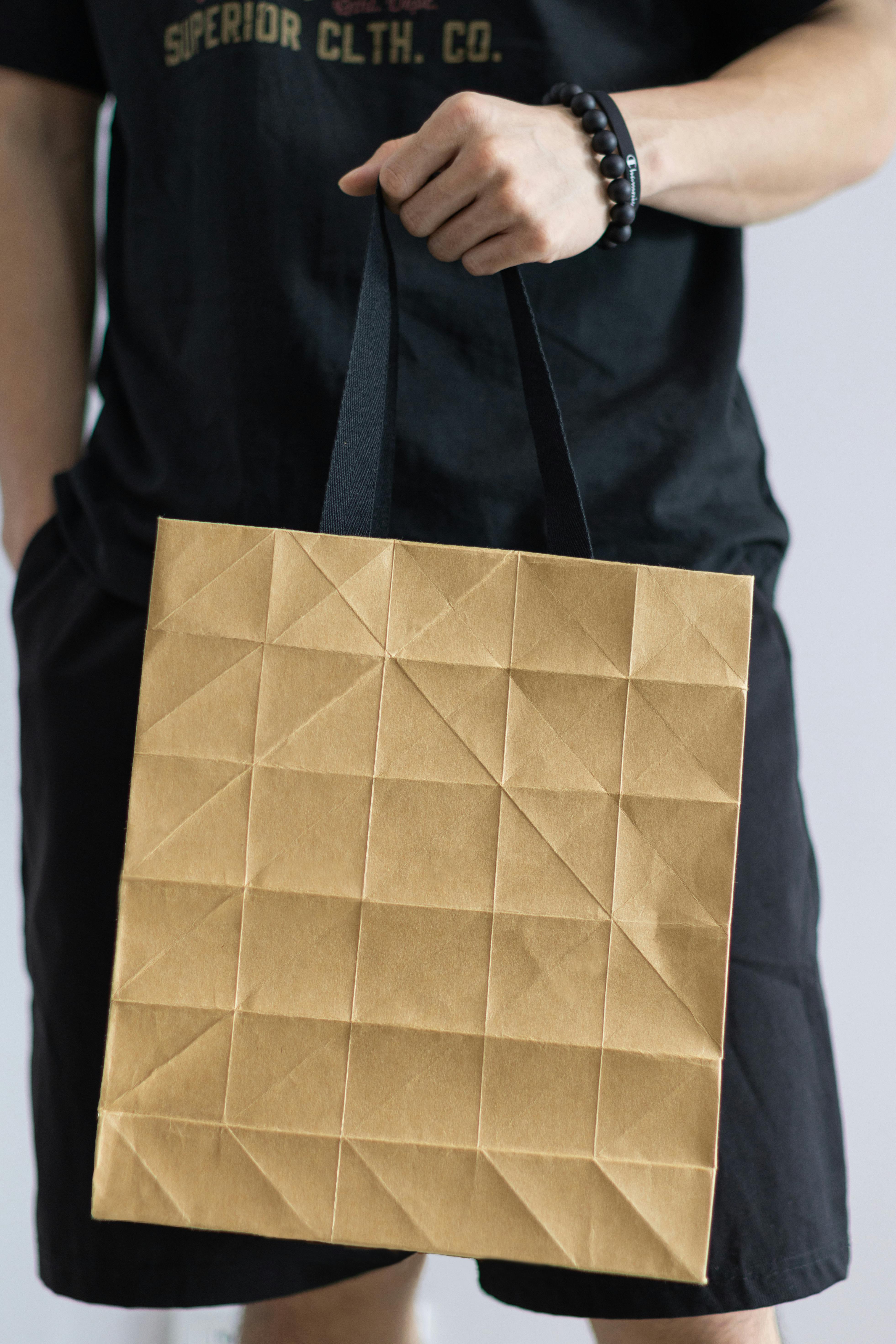 Hand with a Ring, Paper Cup, Handbag and Flowers in a Shopping Bag ...