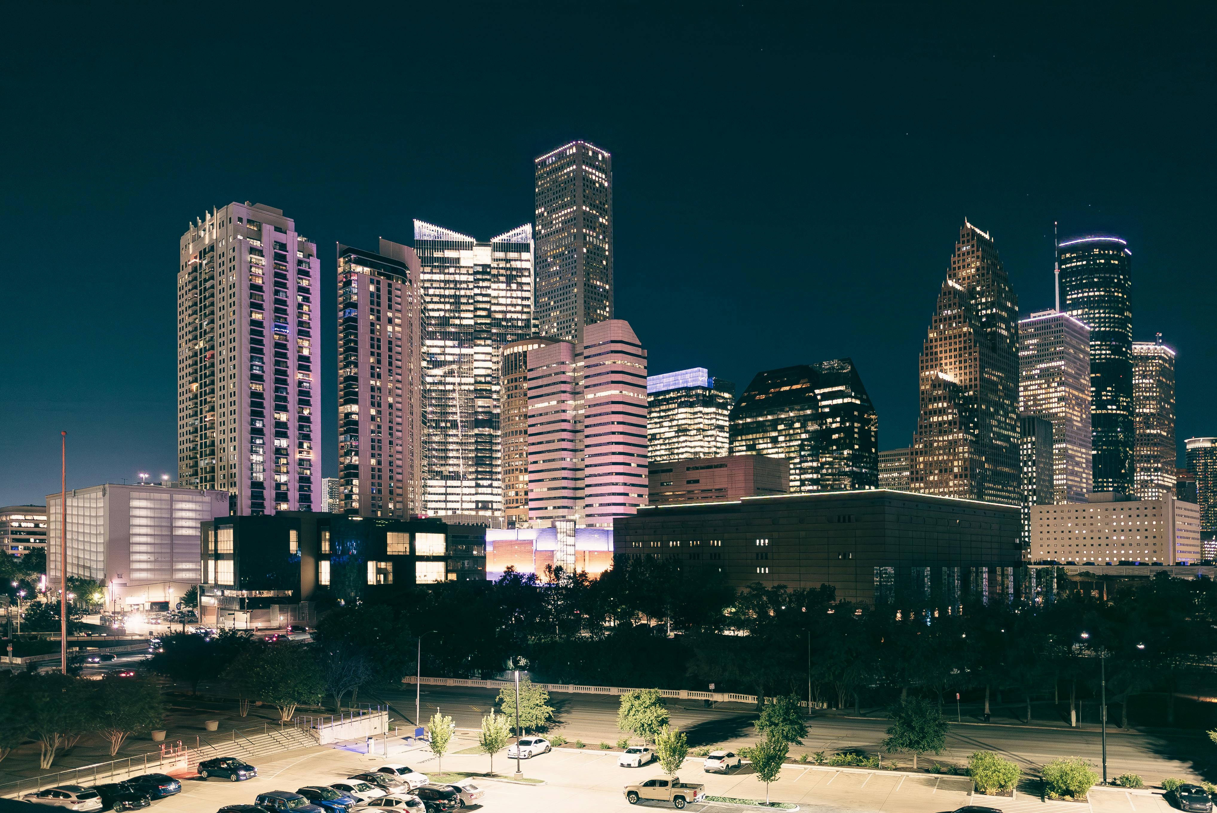 Spectacular night view of the illuminated Houston skyline with modern skyscrapers.