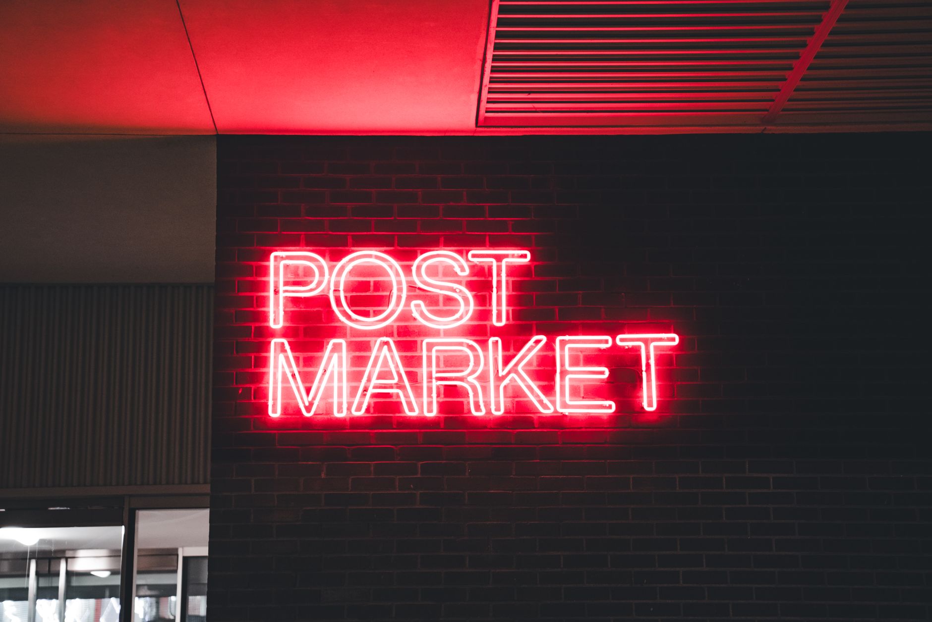 A Neon Sign on a Wall
