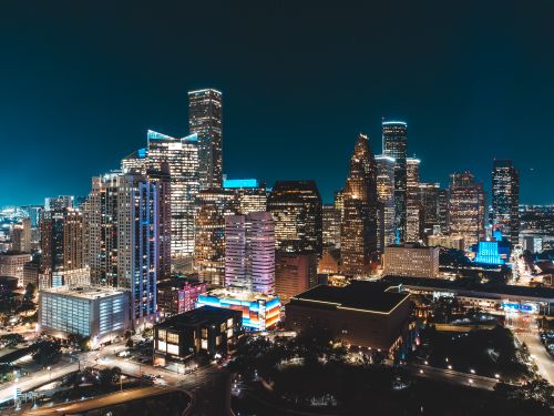 Free Stunning illuminated skyline capturing the essence of urban nightlife. Bright skyscrapers light up the night. Stock Photo