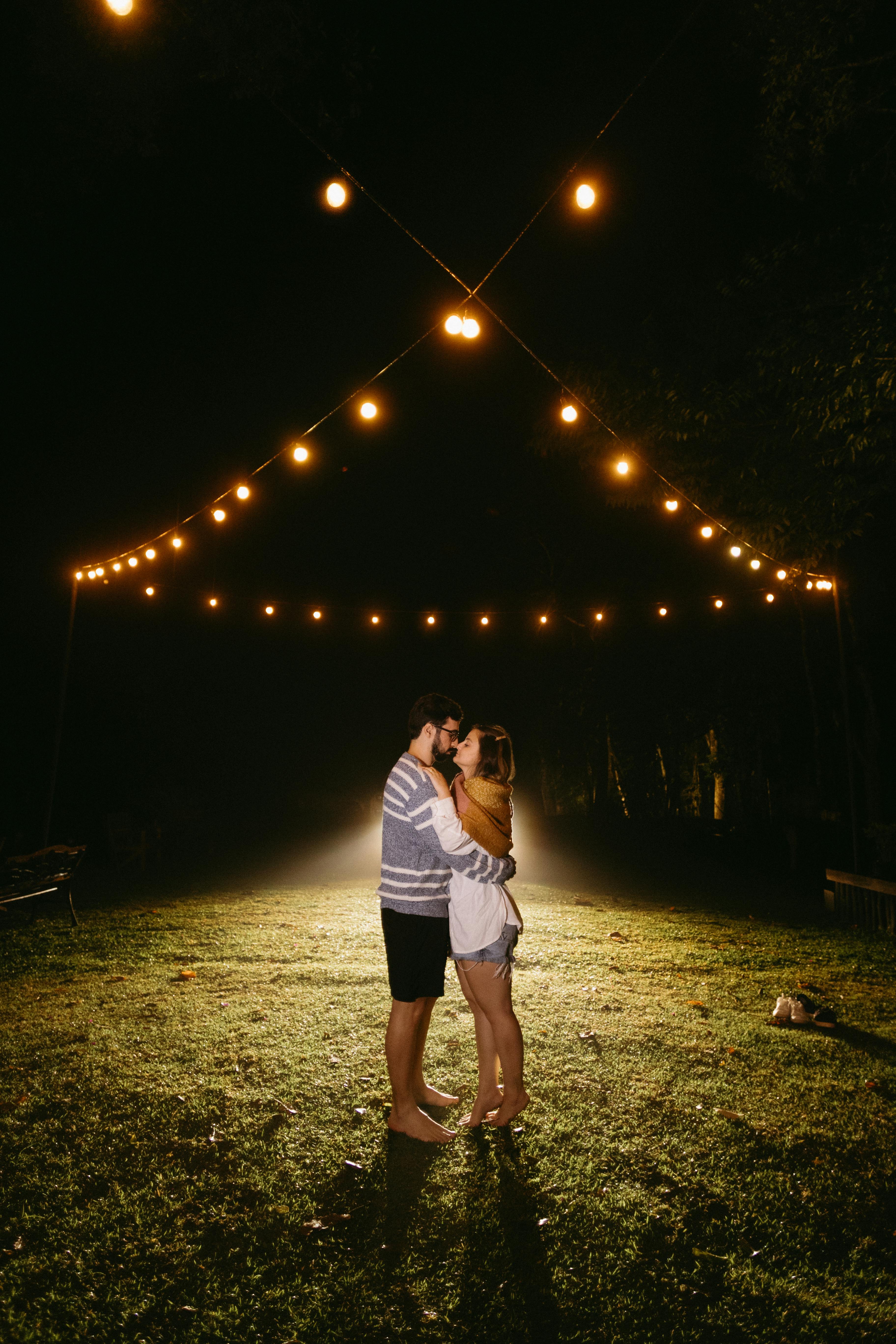 A Couple Kissing at Night · Free Stock Photo
