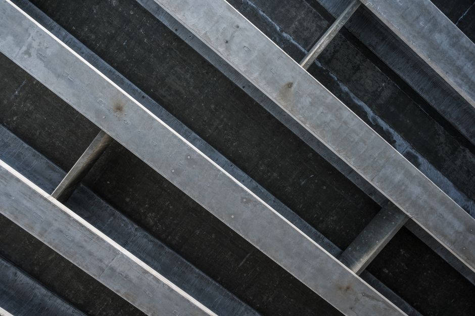 Close-up of a modern concrete structure with angular design and texture.