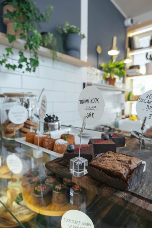 Free Delicious array of cakes and pastries in a charming Tallinn café, perfect for a sweet indulgence. Stock Photo