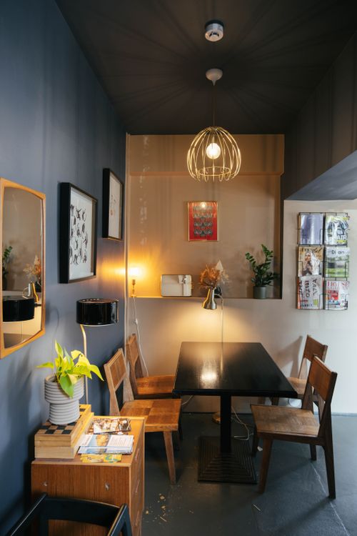 Free A stylish, contemporary café corner in Tallinn with wooden furniture and warm lighting. Stock Photo