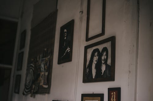 Brown Wooden Photo Frame Hangs on Wall