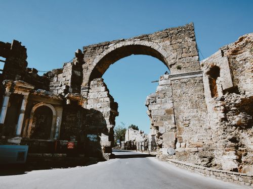 Free Discover the historic Vespasian Gate, a stunning Roman arch in Side, Turkey. Stock Photo