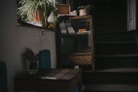 Square Brown Wooden Table Near Staircase