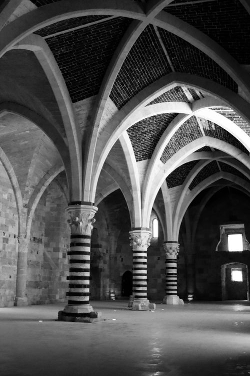 Free Black and white photo of Gothic arches and columns inside Castello Maniace, Syracuse. Stock Photo