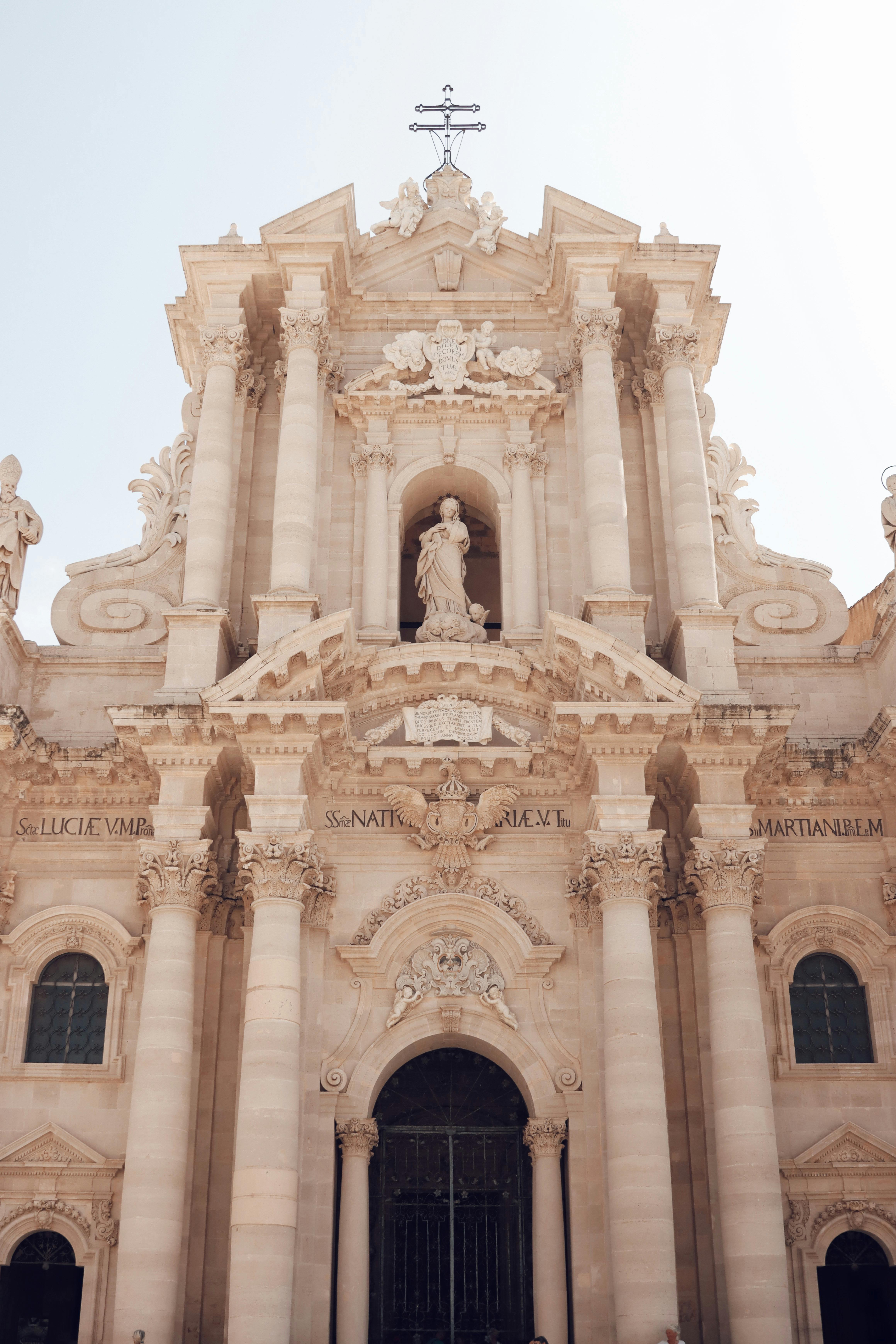 Stunning Baroque facade of Cathedral of Syracuse in Italy highlighting intricate architectural details.