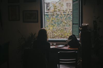 Person reading quietly by a window by Sheep . on Pexels