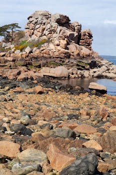 Eroded rock formations on the scenic coast of Perros-Guirec, Brittany, France.