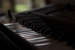 Close-up of piano keys in soft light — photo by Gerald Munduga on Pexels