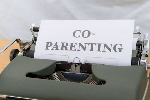 A typewriter with a paper that says co - parenting